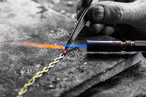 With a long history in the Jewellery and Diamond trade, Chris sand Cecilia of Orbis Jewellery can provide a full jewellery repair and restoration service from their workshop based in Bawtry. Here Chris is repairing a yellow gold pendant.